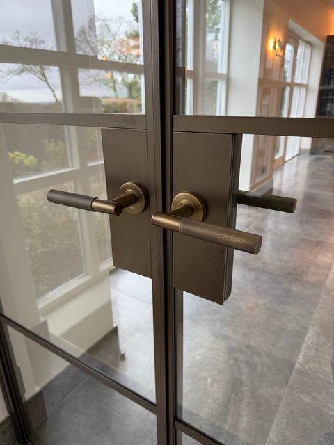 Antique Bronze Deco handles showcasing the range of hardware options available across our steel door collection. Every steel door is fully customisable, allowing each detail to be tailored to the style and character of the space.