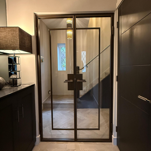 Modern interior with a glass door leading to a staircase