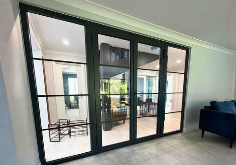 Large black FD30 steel fire rated steel door with fixed side panels