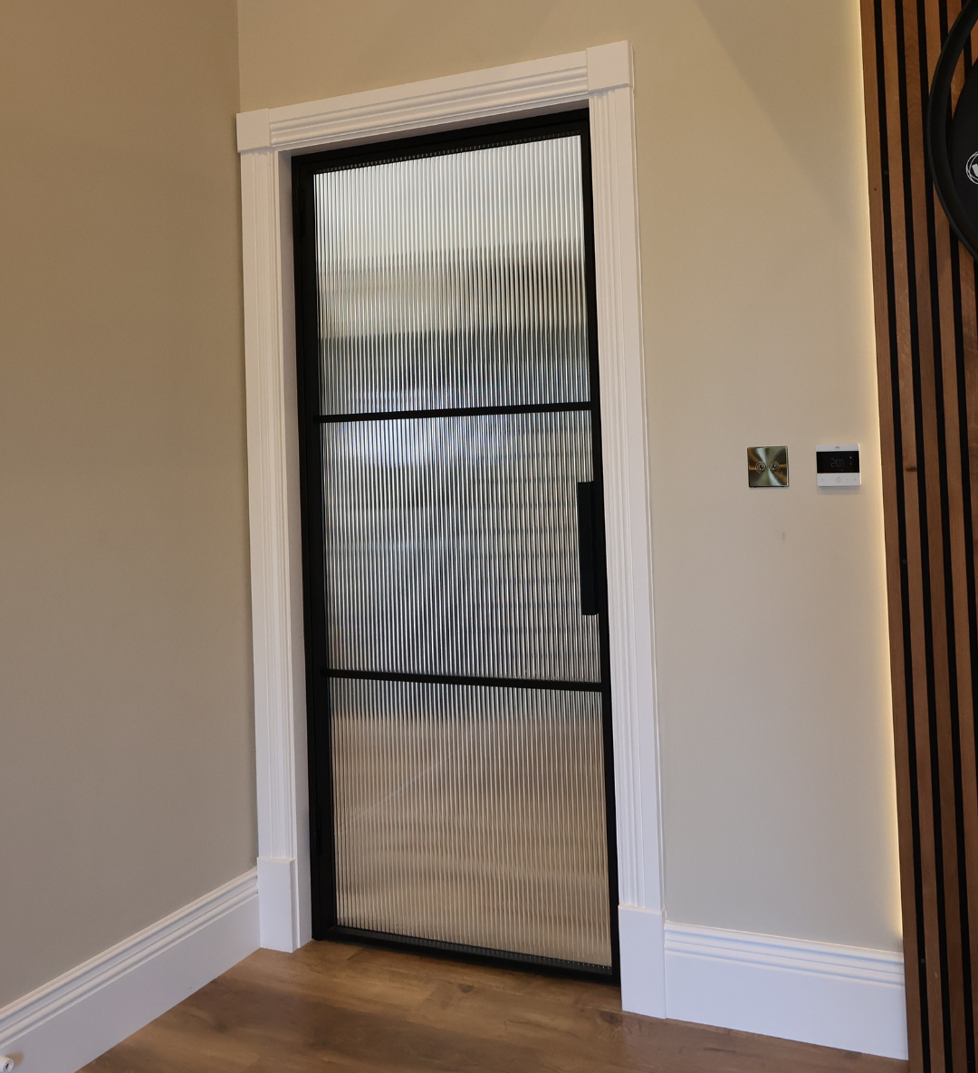 Fluted glass steel door with pull handles