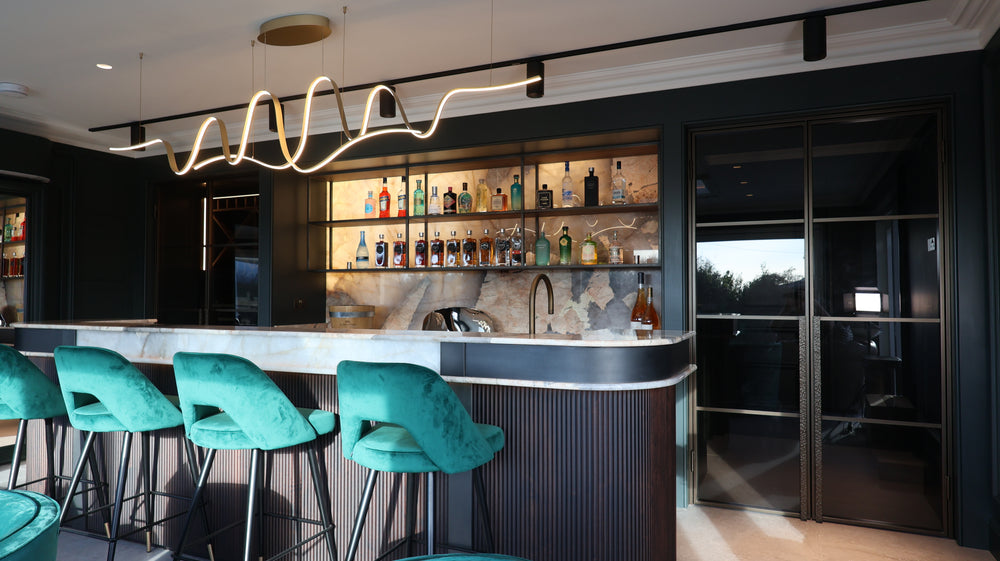 Modern bar with two double steel doors finished in manor house bronze with hammered pull handles