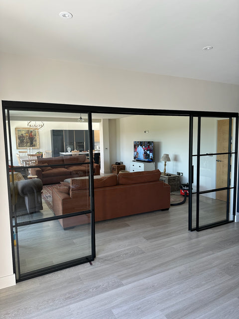 Living room with a large glass sliding door