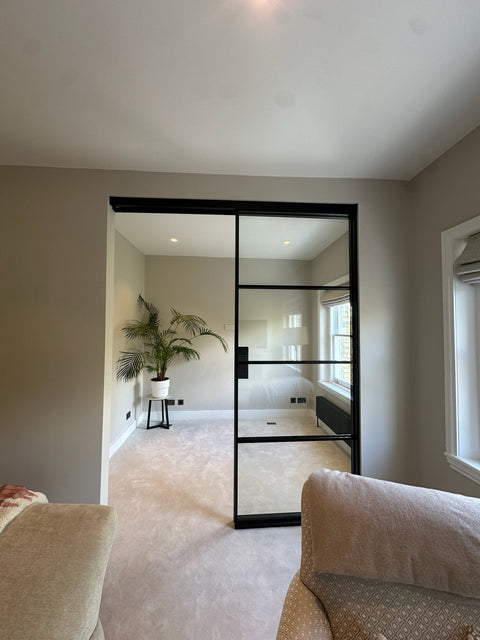 Modern interior with a sliding door between two rooms.