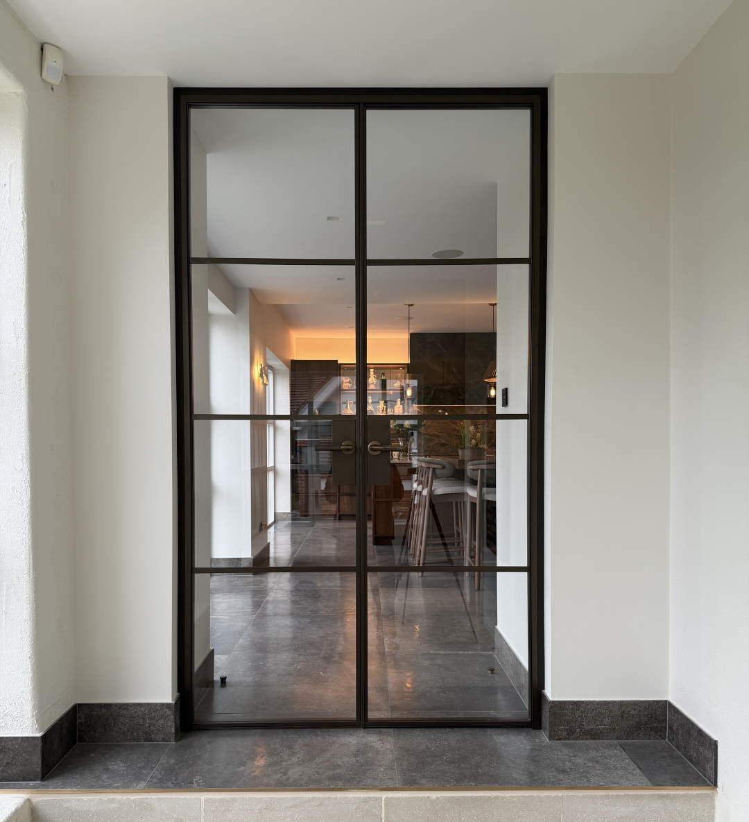 Bespoke steel door finished in manor house bronze for a luxury home