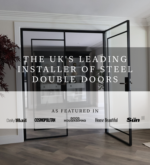 Steel double doors in a modern interior with slim black steel framing and full height glazing, opening into a bright living space, with overlay text stating the UK’s leading installer of steel double doors and featured publication logos.