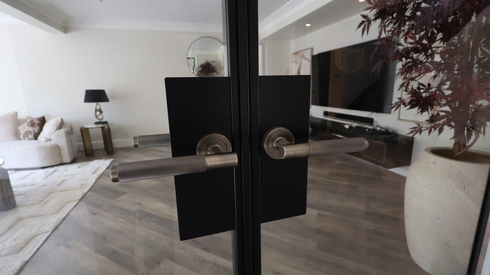 A close up of this handle option. Black Steel door with Gun metal handle