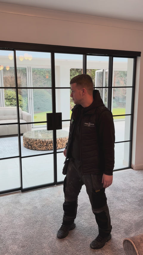 Video demonstrating how the Concertina sliding steel door opens and folds smoothly, featuring slimline black steel frames and glazed panels designed to maximise light and flexible living space.